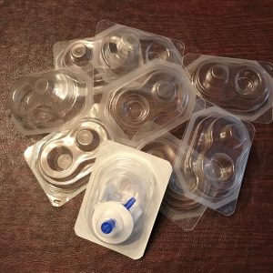 Pile of mostly empty plastic packaging from insulin infusion sets